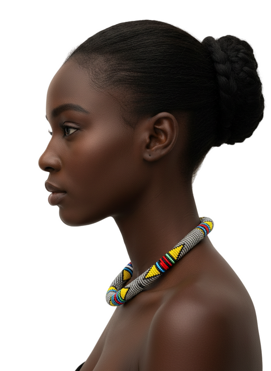 Woman wearing a colorful beaded necklace against a neutral background